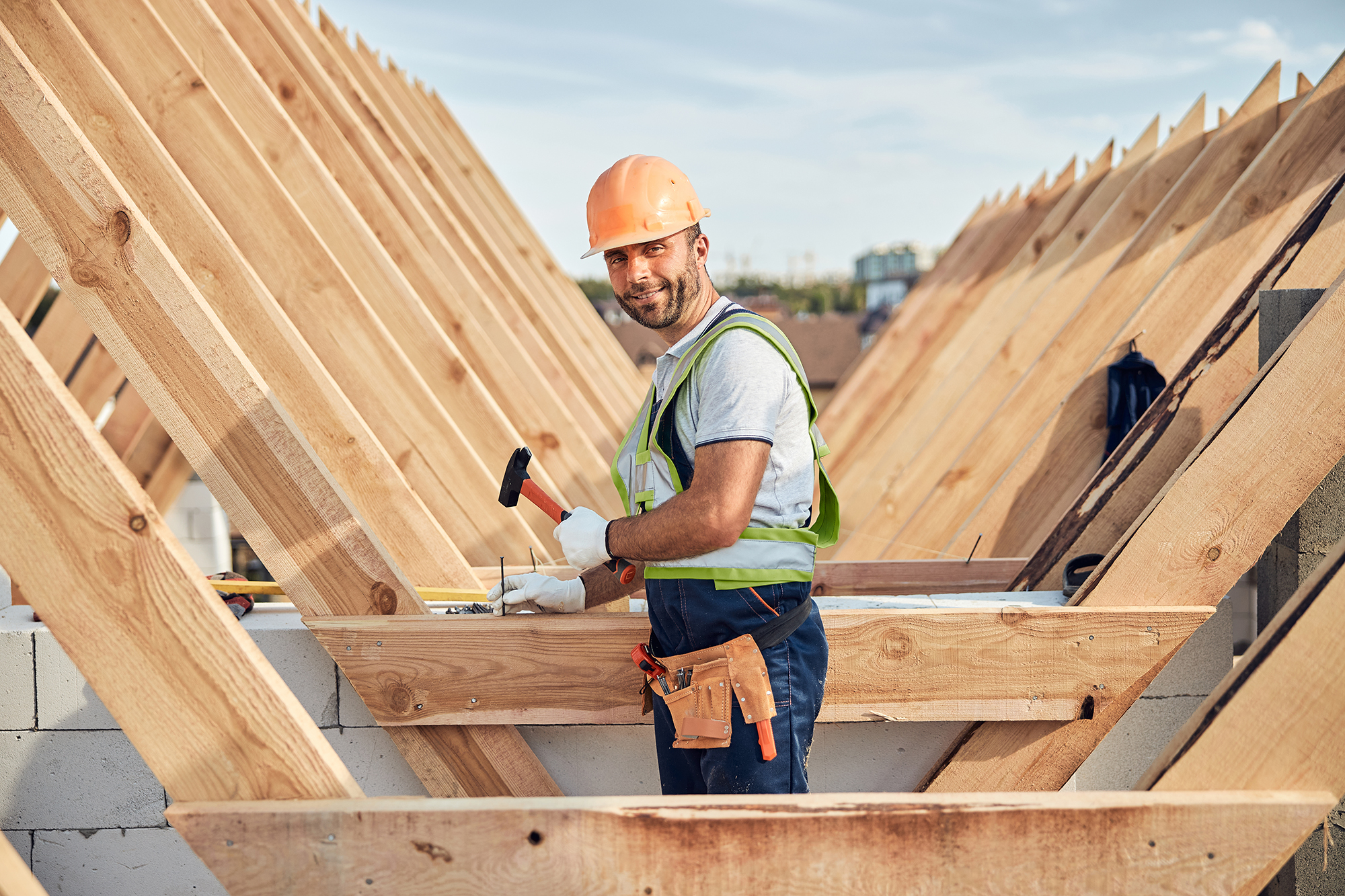 Roofer constructing new roof trusts